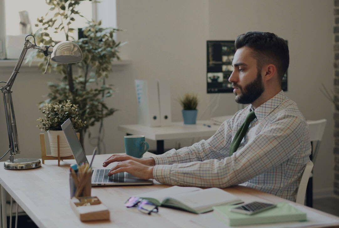 Professional web design Hamilton - Back9 Digital expert working on website project in modern office