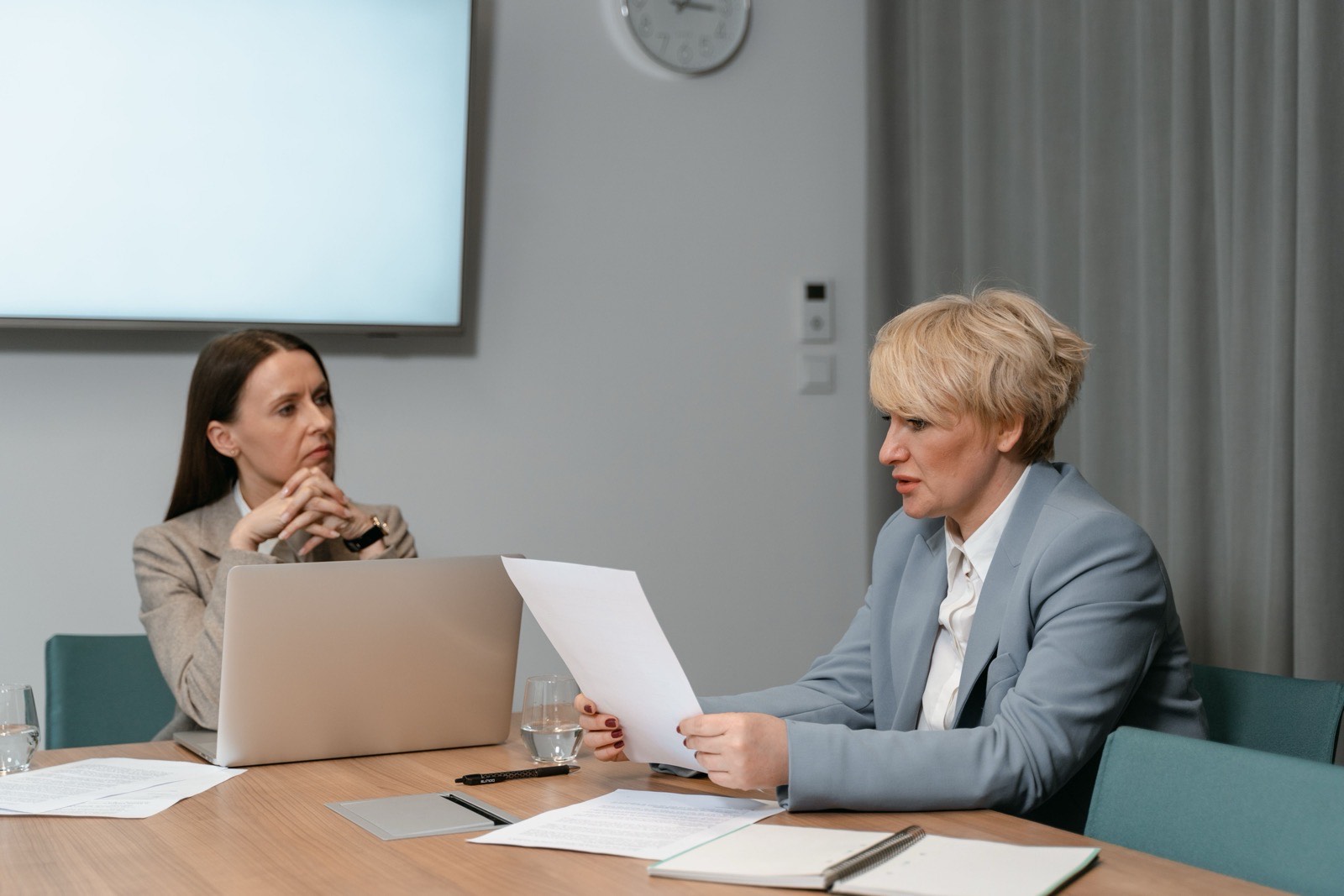 Accounting team reviewing paperwork in a firm meeting room