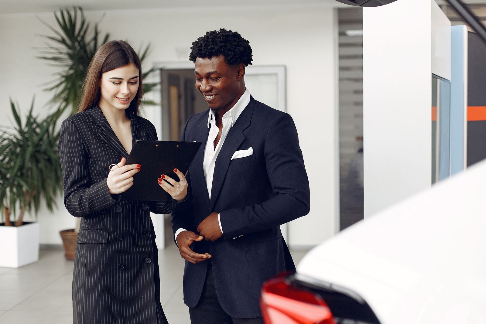 Service advisor reviewing a written estimate with a customer