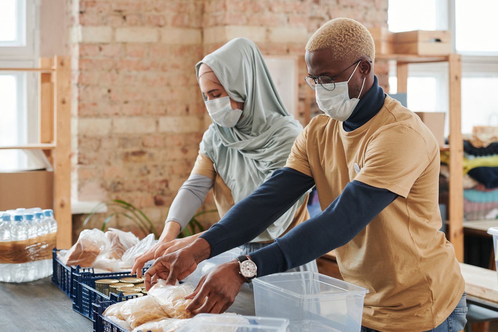 Volunteers packing food donations at a community food bank