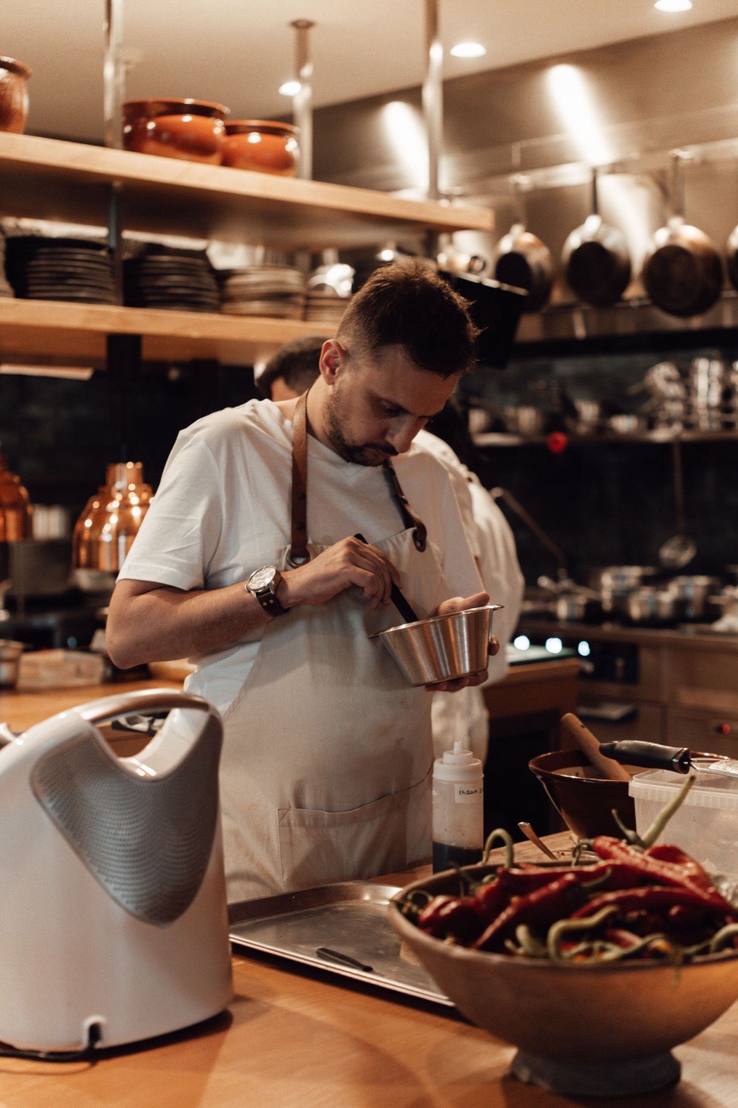 Chef preparing a dish in a professional restaurant kitchen