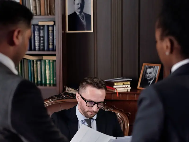 Lawyers reviewing documents in a Hamilton law office