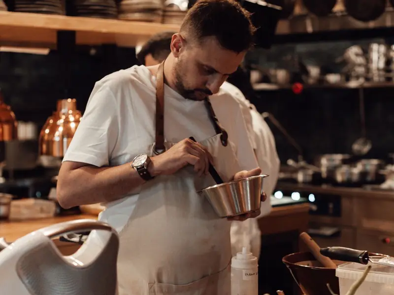 Chef preparing food in a Hamilton restaurant kitchen